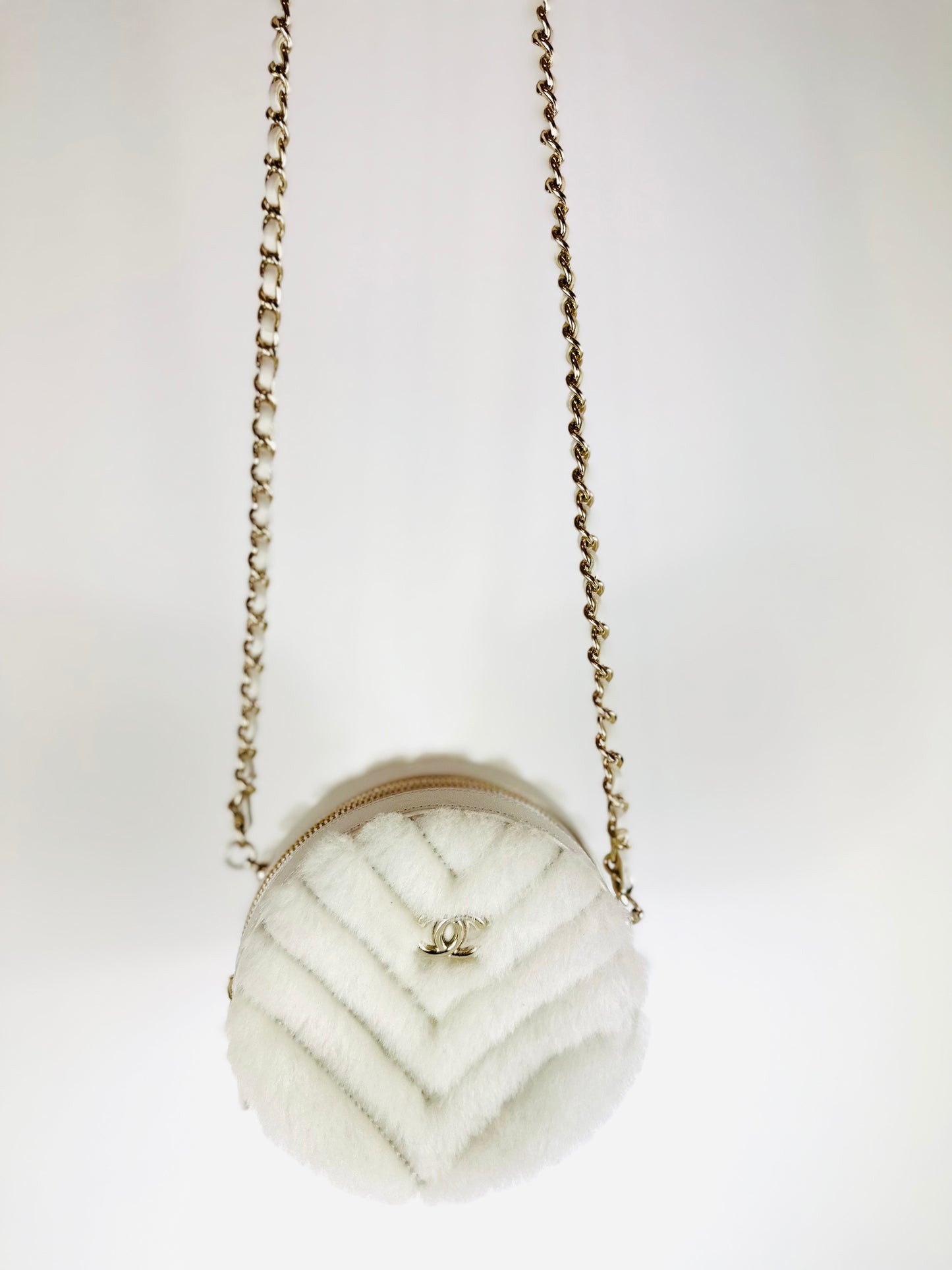 CHANEL - Quilted Round bag white shearling Coco Neige