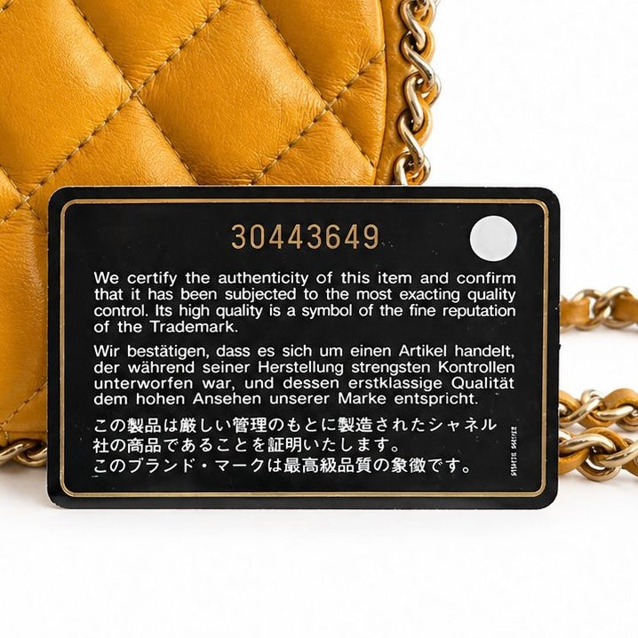 CHANEL - BAG ROUND OCHRE YELLOW WITH CHAIN