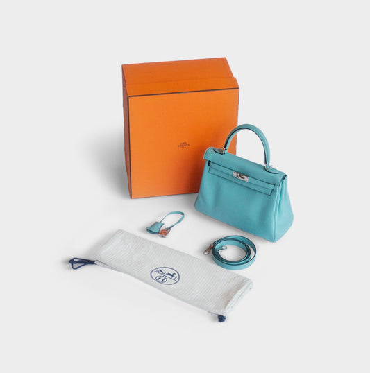 HERMÈS -  BAG KELLY 25 LIGHT BLUE SWIFT LEATHER PALLADIUM HARDWARE