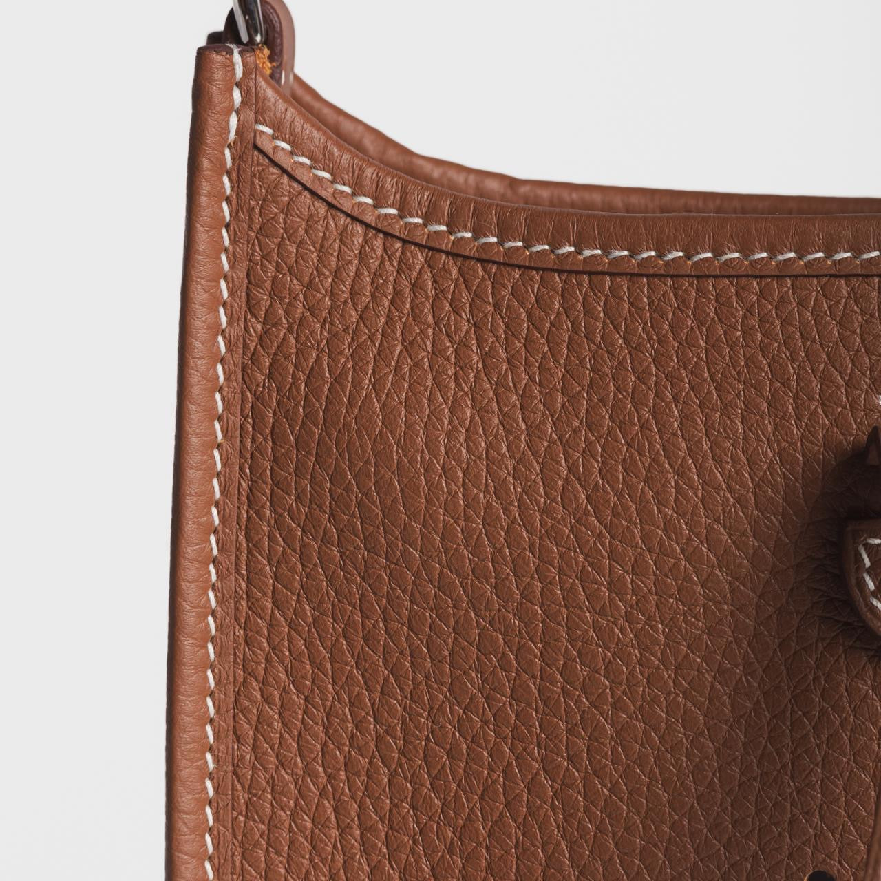 HERMÈS - *BRAND NEW* MINI EVELINE TAURILLON CLEMENCE GOLD