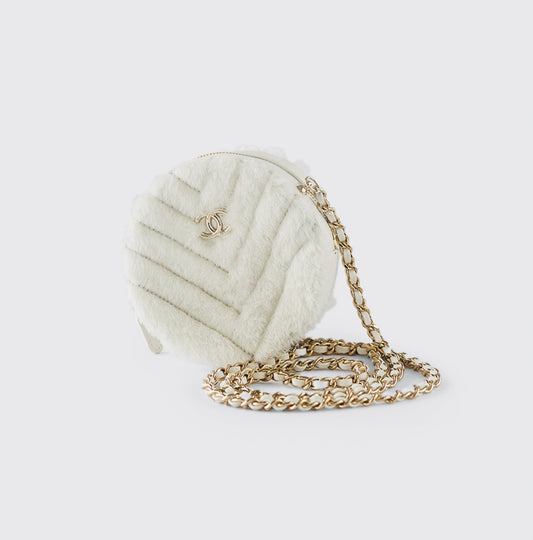 CHANEL - QUILTED ROUND BAG WHITE SHEARLING COCO NEIGE