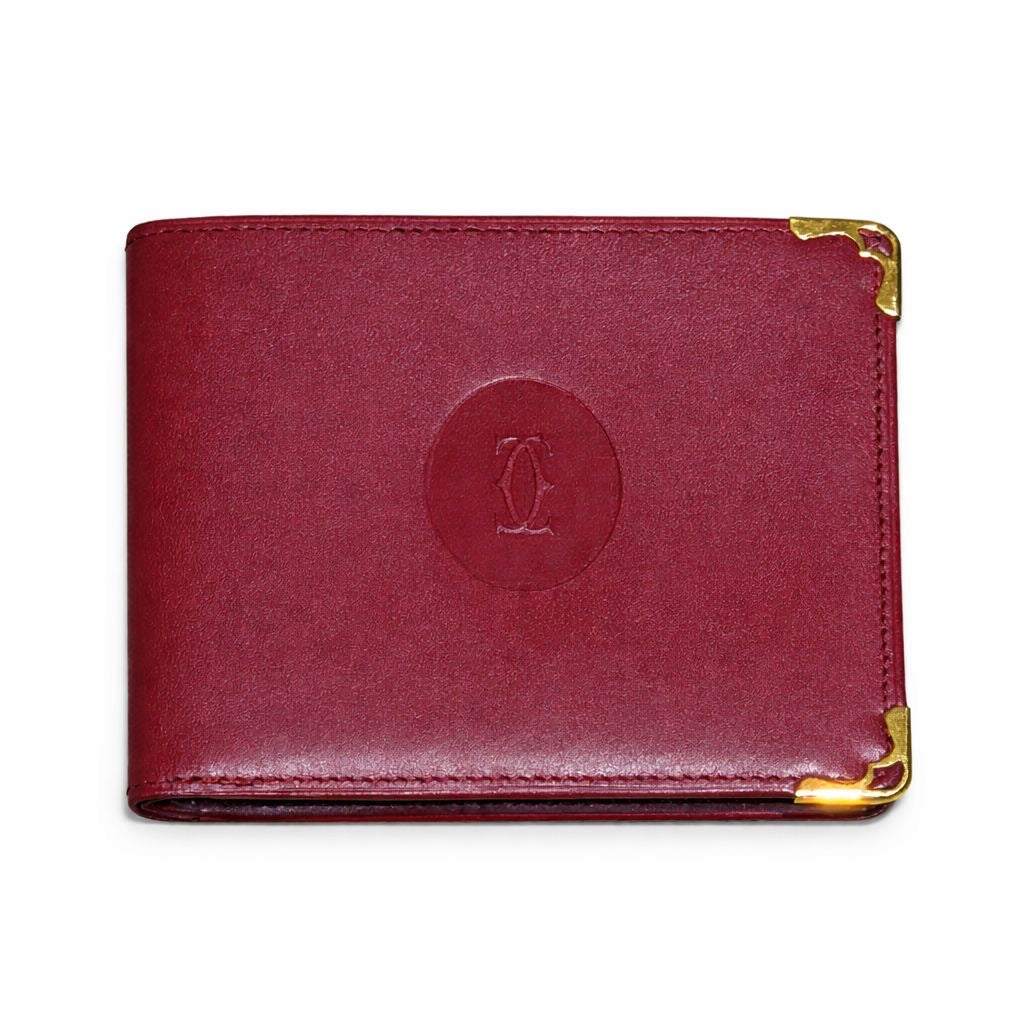 CARTIER - WALLET MUST DE CARTIER BORDEAUX LEATHER WITH GOLD-TONE CORNERS