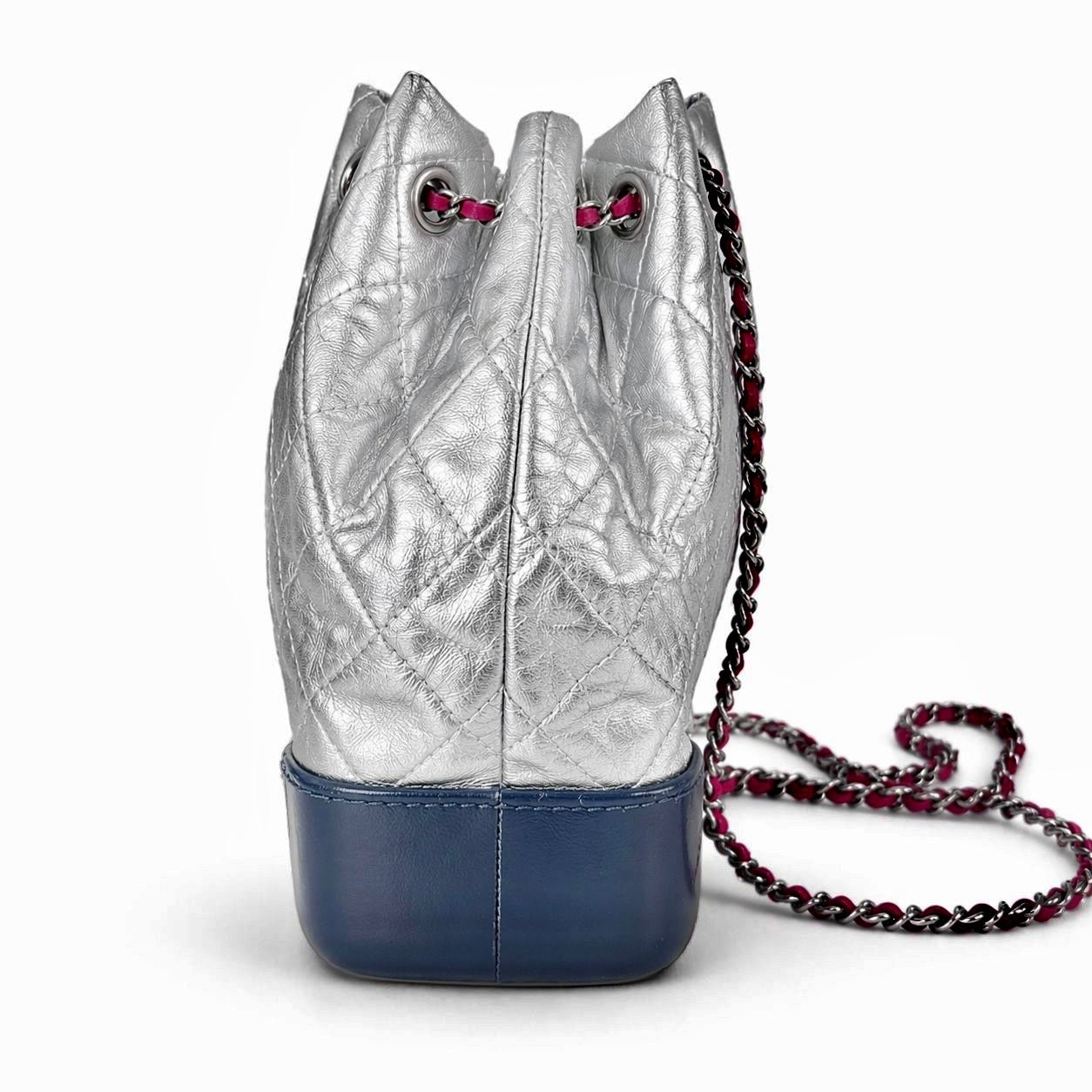 CHANEL - BACKPACK BAG GABRIELLE SILVER WITH NAVY LEATHER BASE