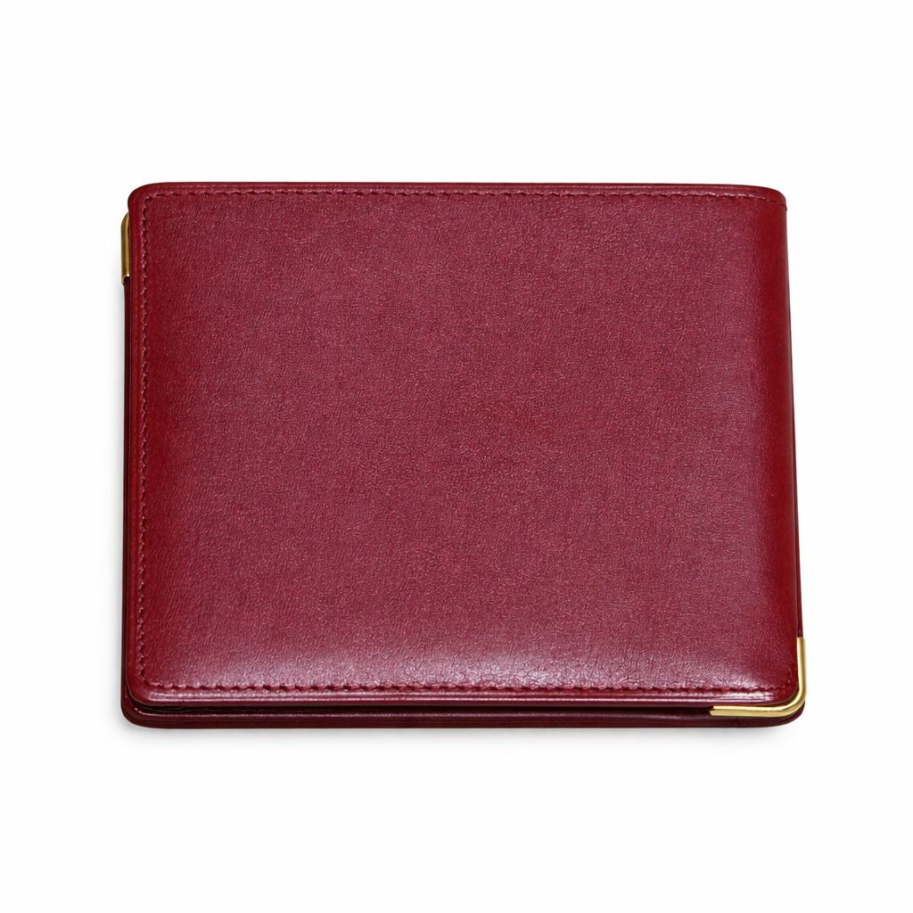 CARTIER - WALLET MUST DE CARTIER BORDEAUX LEATHER WITH GOLD-TONE CORNERS