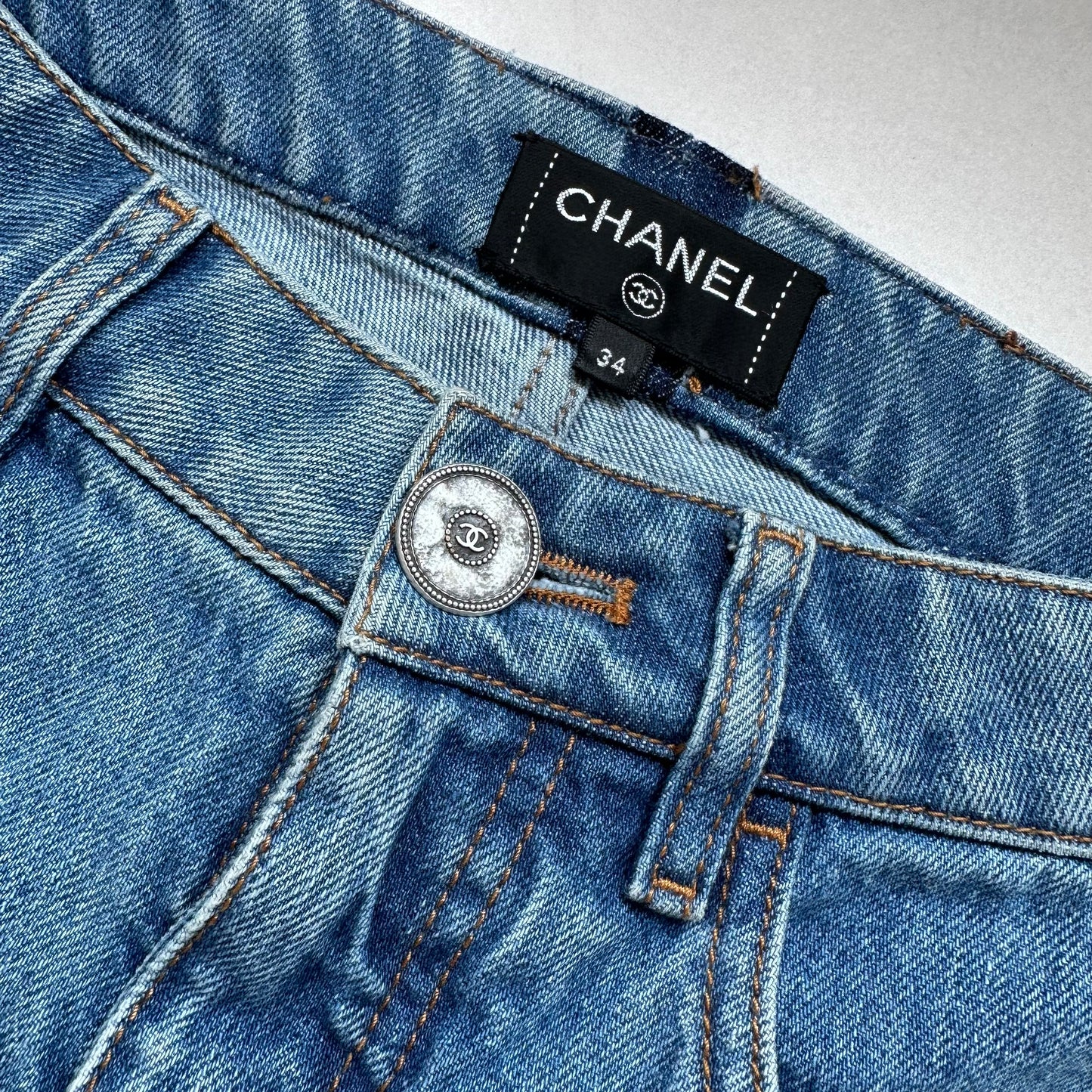 CHANEL - DENIM BLUE JEANS WITH PHARREL RED LOGO ON BACK POCKET SIZE 34 FR