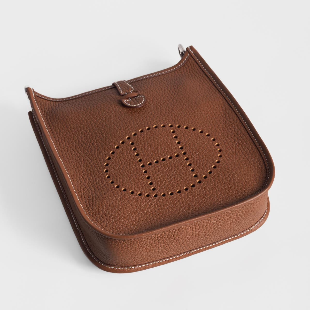 HERMÈS - *BRAND NEW* MINI EVELINE TAURILLON CLEMENCE GOLD