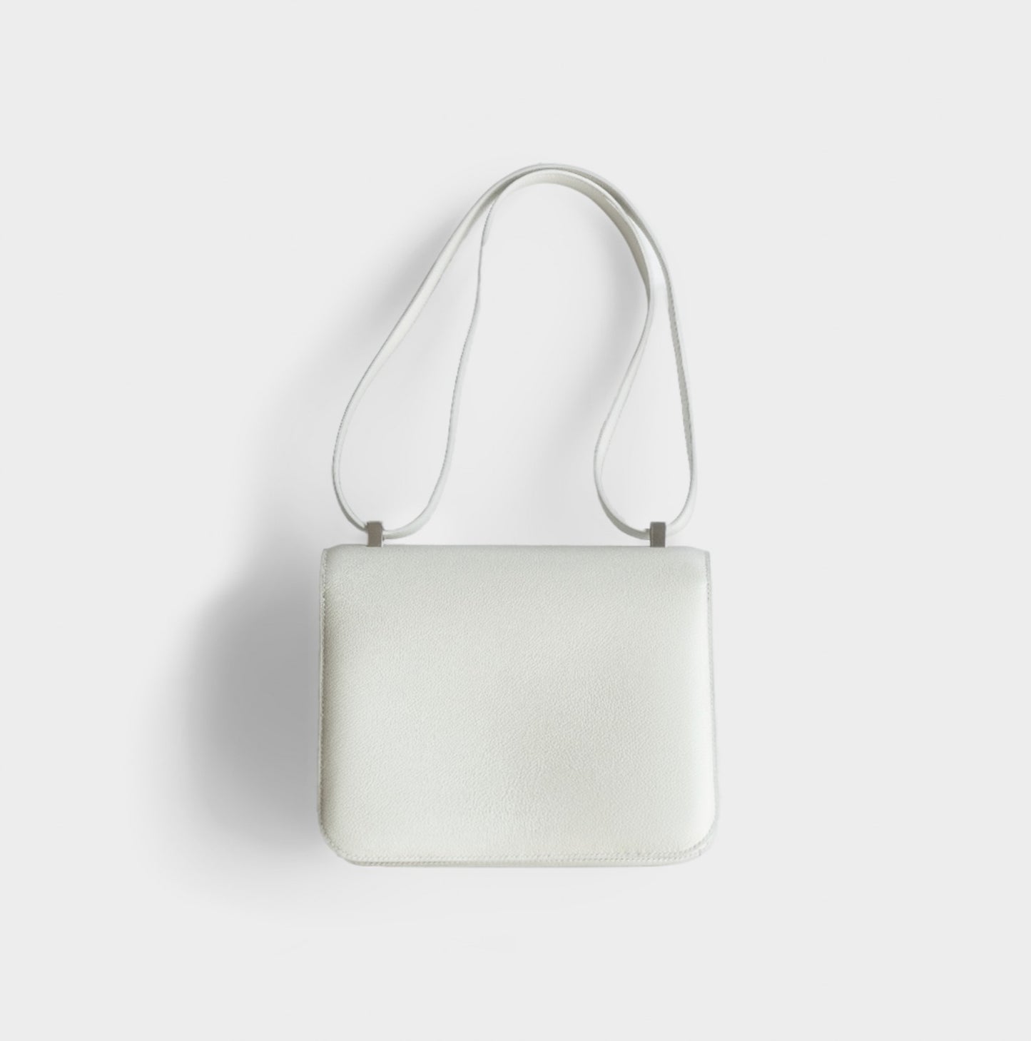 HERMÈS - CONSTANCE 24 SHOULDER BAG WHITE WITH PALLADIUM HARDWARE