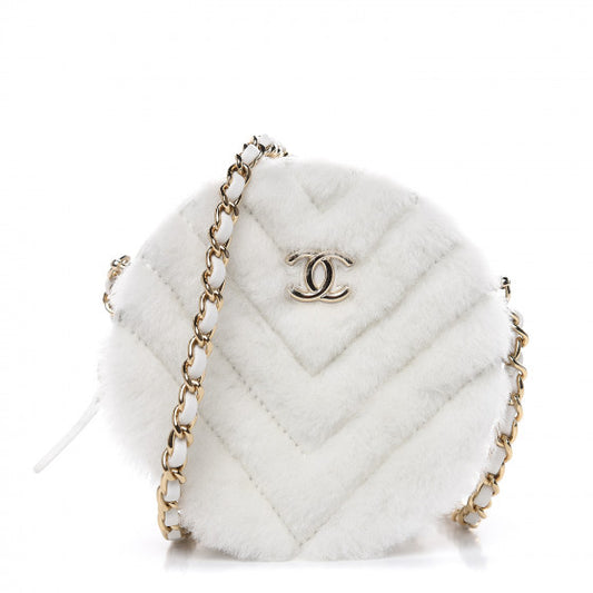 CHANEL - Quilted Round bag white shearling Coco Neige